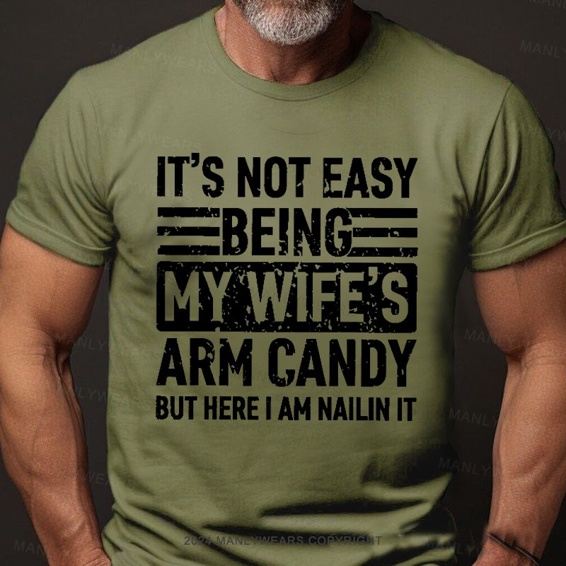 It's Not Easy Being My Wife's Arm Candy But Here I'm Nailing It T-shirt